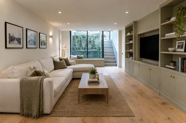Converted basement family room with lightwell glazing and built-in joinery