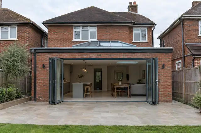 Single-storey rear extension with bifold doors and a roof lantern on a red-brick 1930s semi